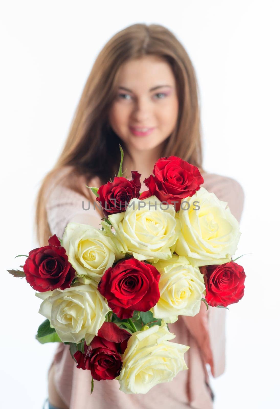 Young girl holds a bouquet of flowers