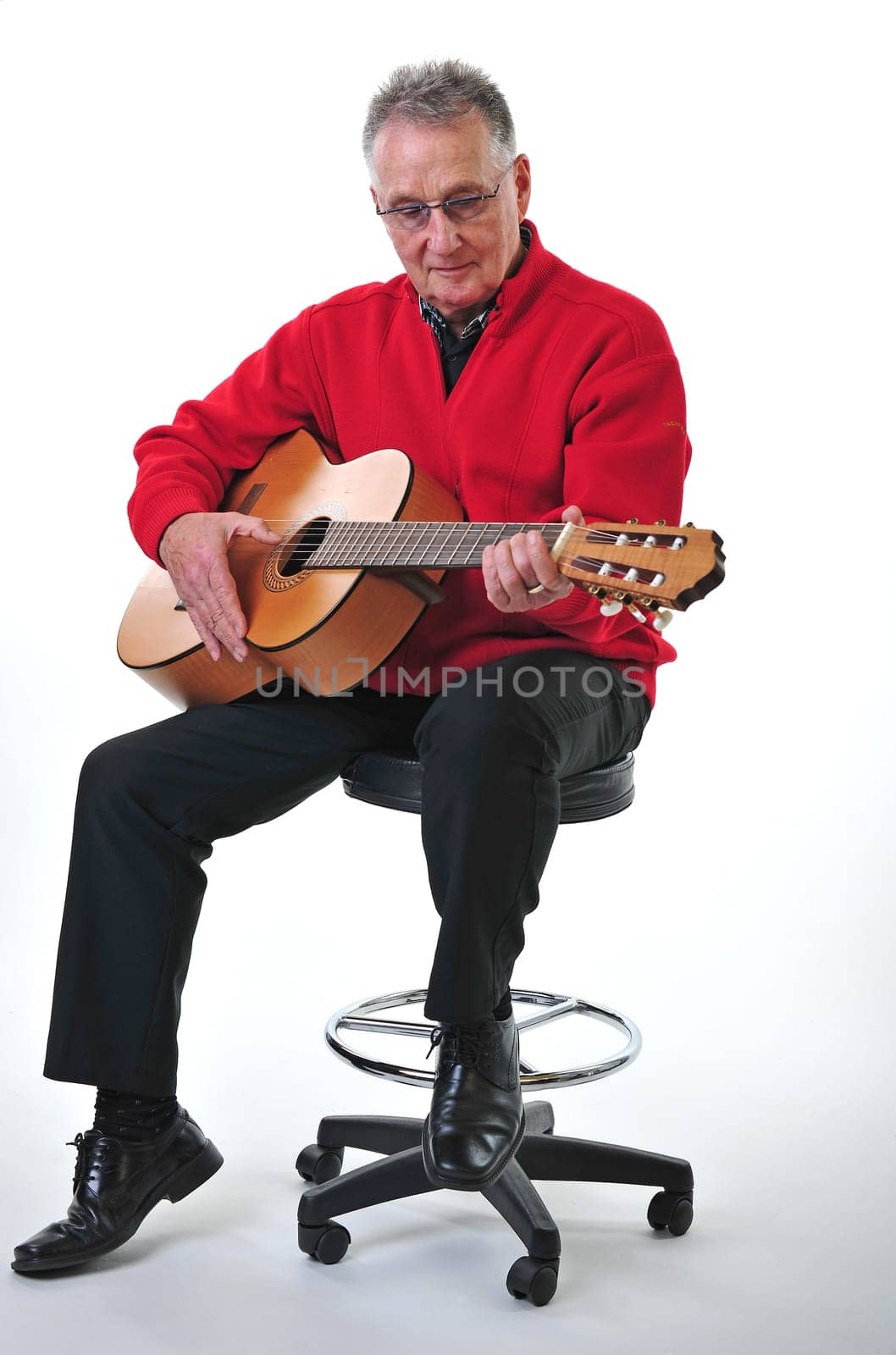 Retired pensioner plays guitar