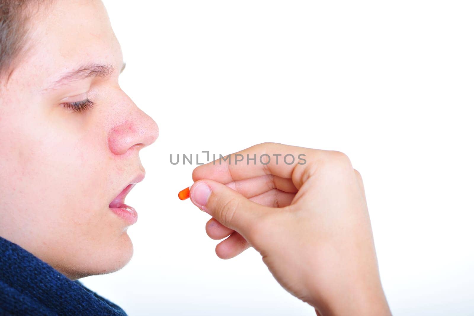 Young man takes medication