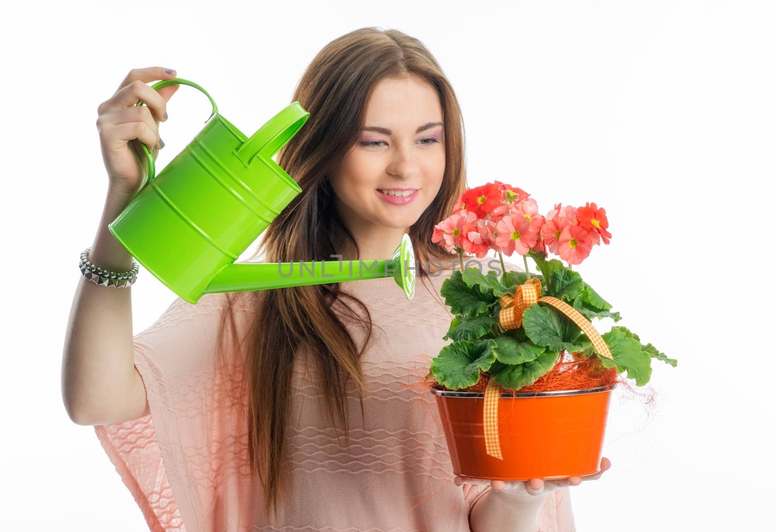 Girl with potted plant and watering can