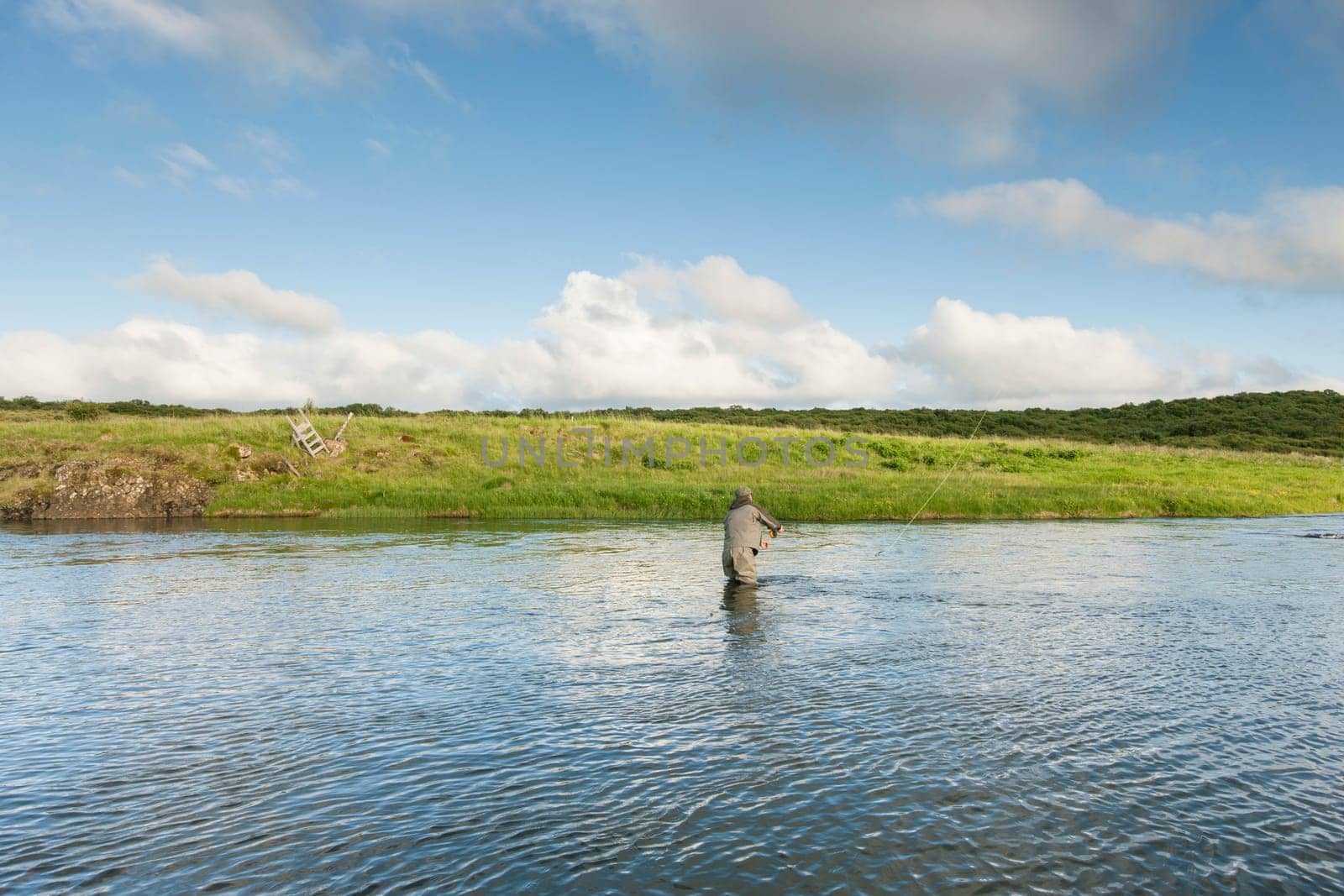 Man fishing for salmon in a beautiful surrounding