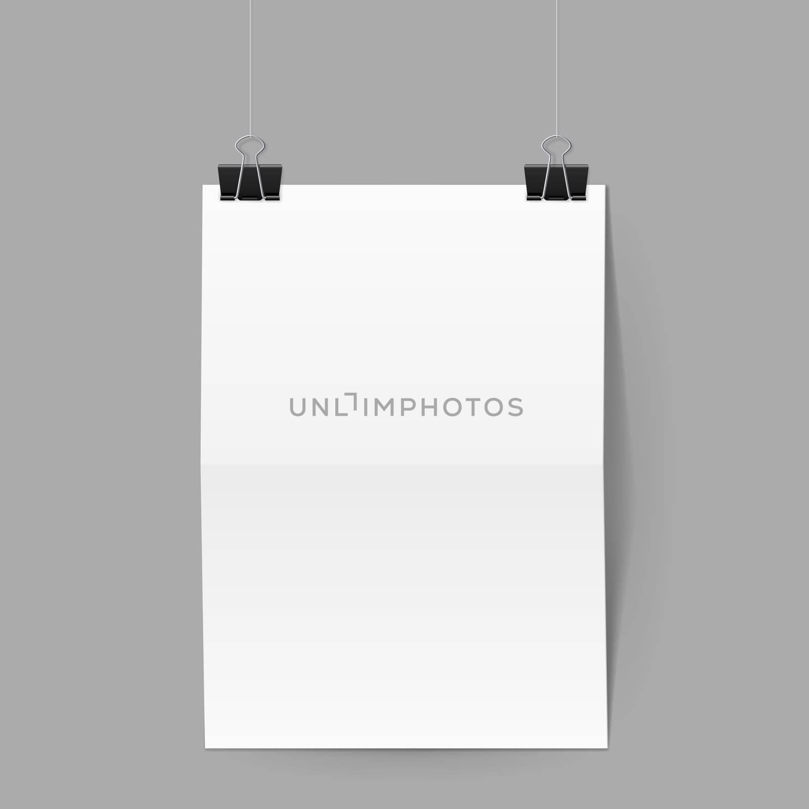 White paper folded in half hands on black clips on grey background
