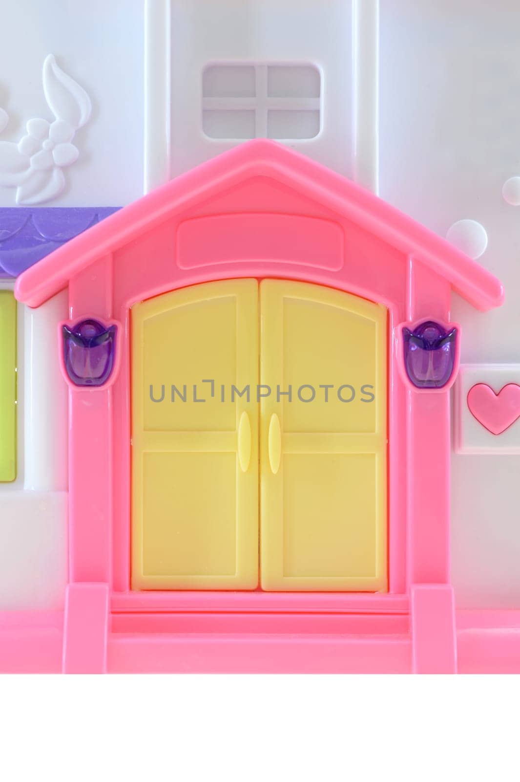 A close up shot of a toy doll house