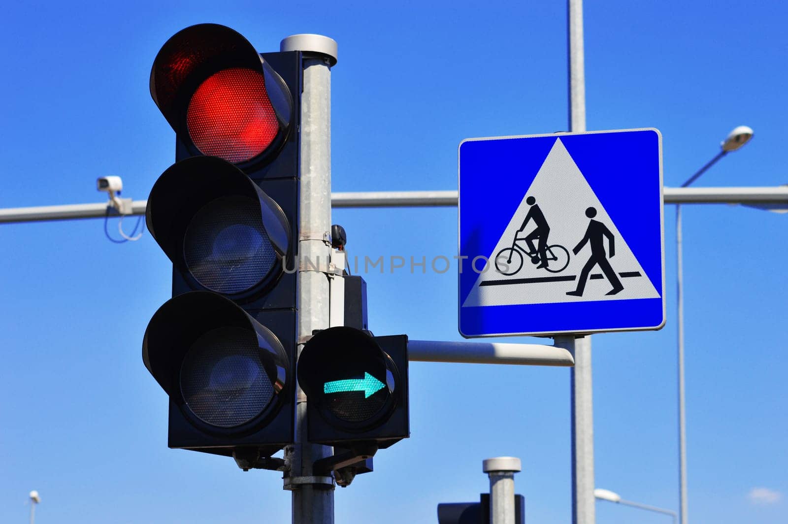 Traffic lights over blue sky