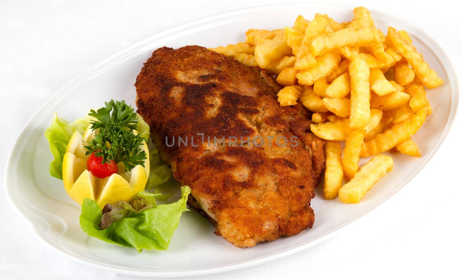 Schnitzel with fries and salad