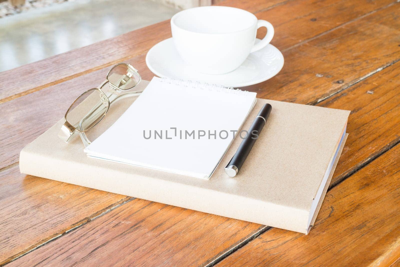 Creative time with cup of coffee and book, stock photo