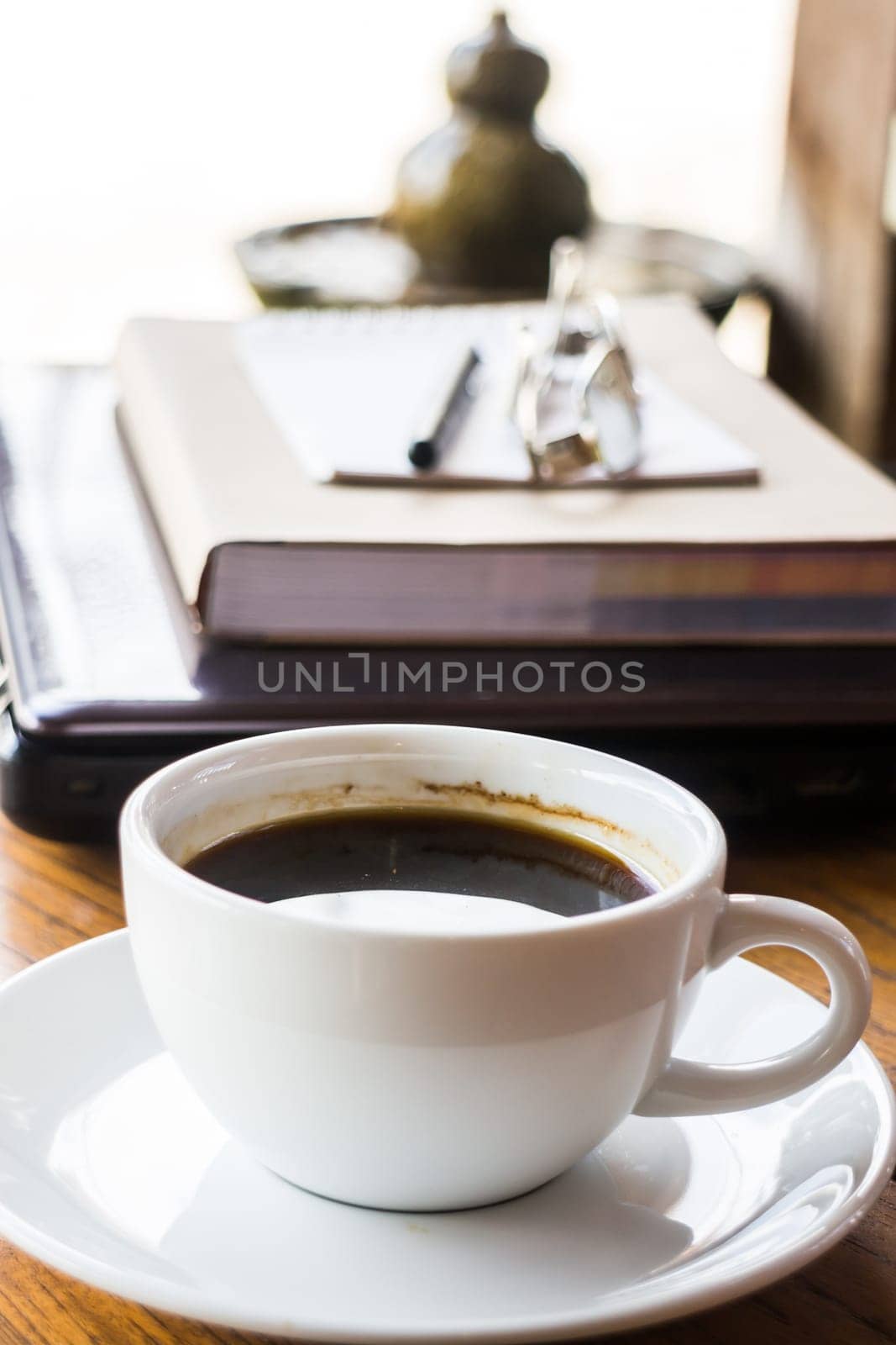 Refreshed drink cup of coffee at work, stock photo