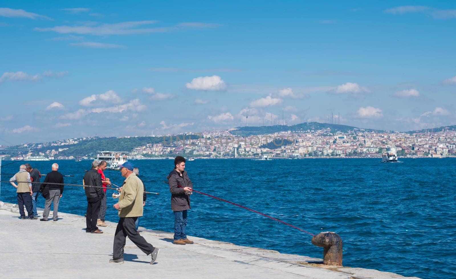 local people fishing on the karakoy quay in Istanbul