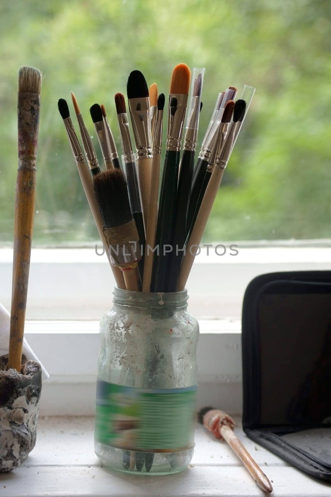 The photography of brushes and painting utensils of an artist.