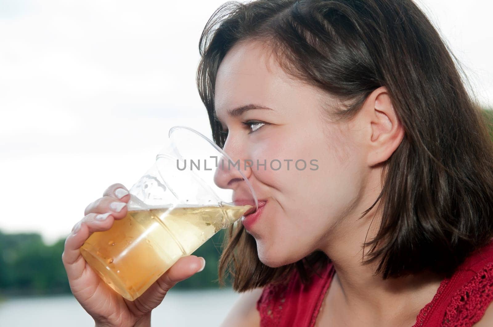 Woman drinks beer
