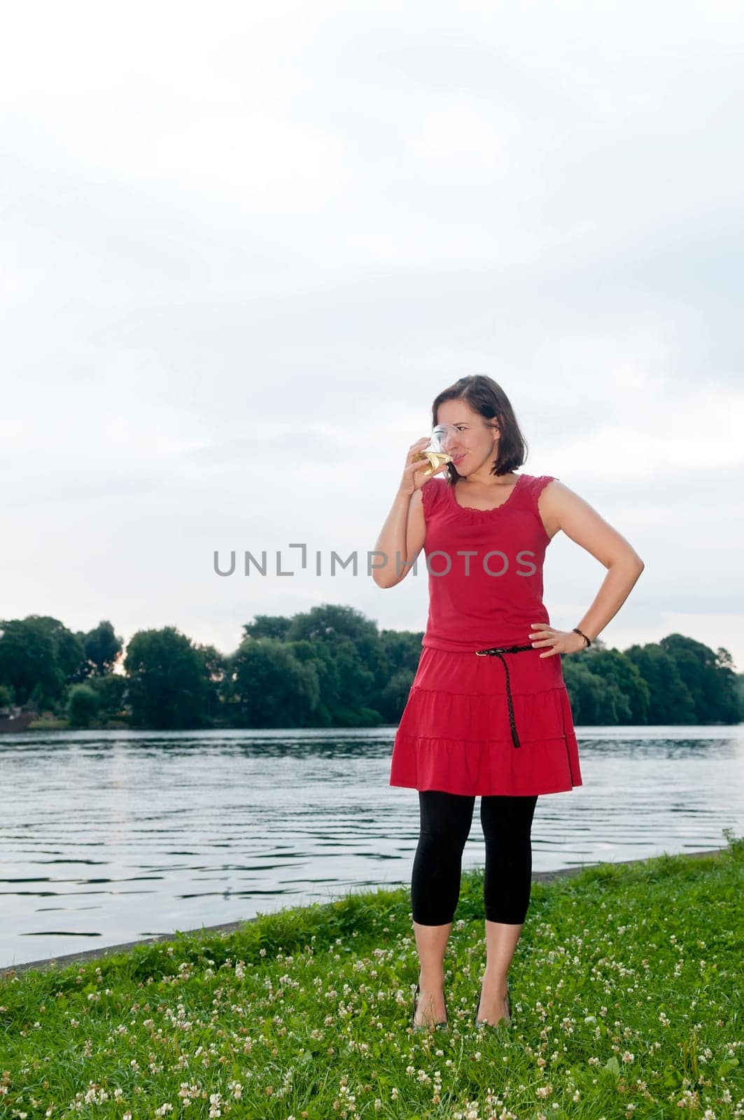Woman drinks beer