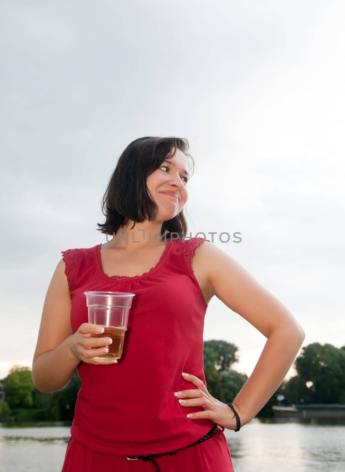 Woman drinks beer
