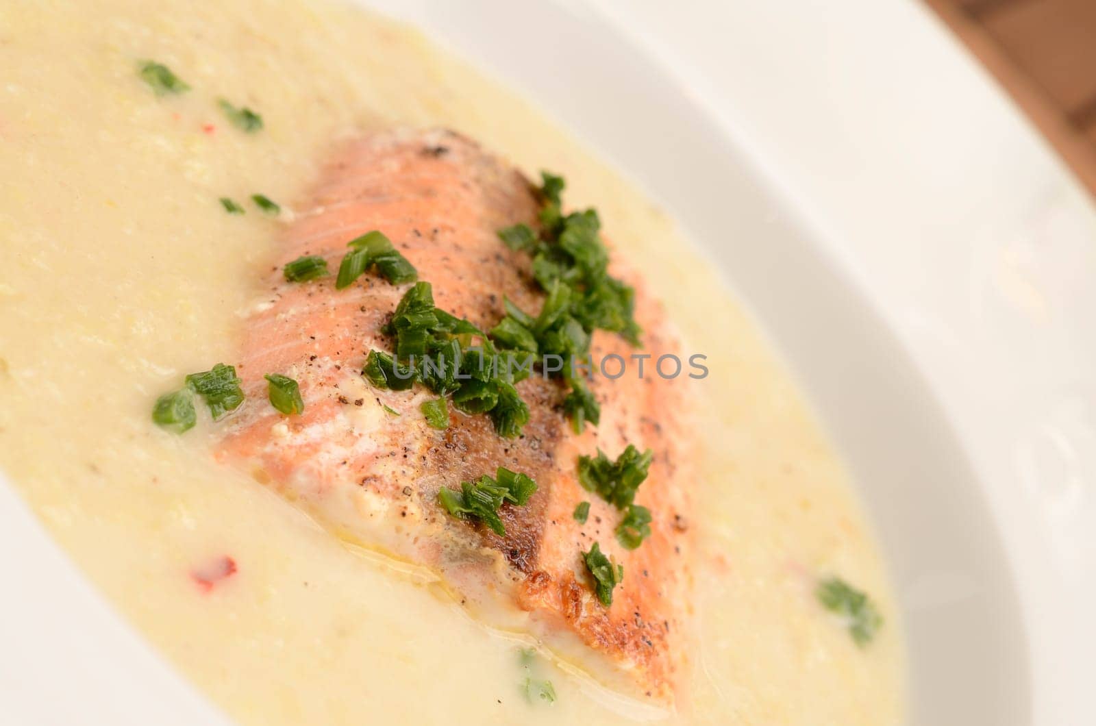 Wild salmon with creamy soup of savoy