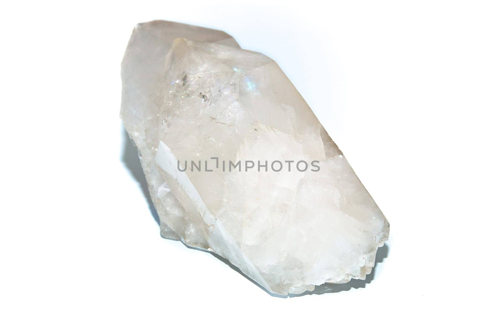 A Large double pointed clear white quartz crystal used for healing over white.