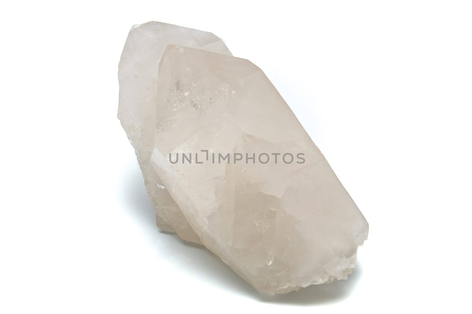 A Large double pointed clear white quartz crystal used for healing over white.