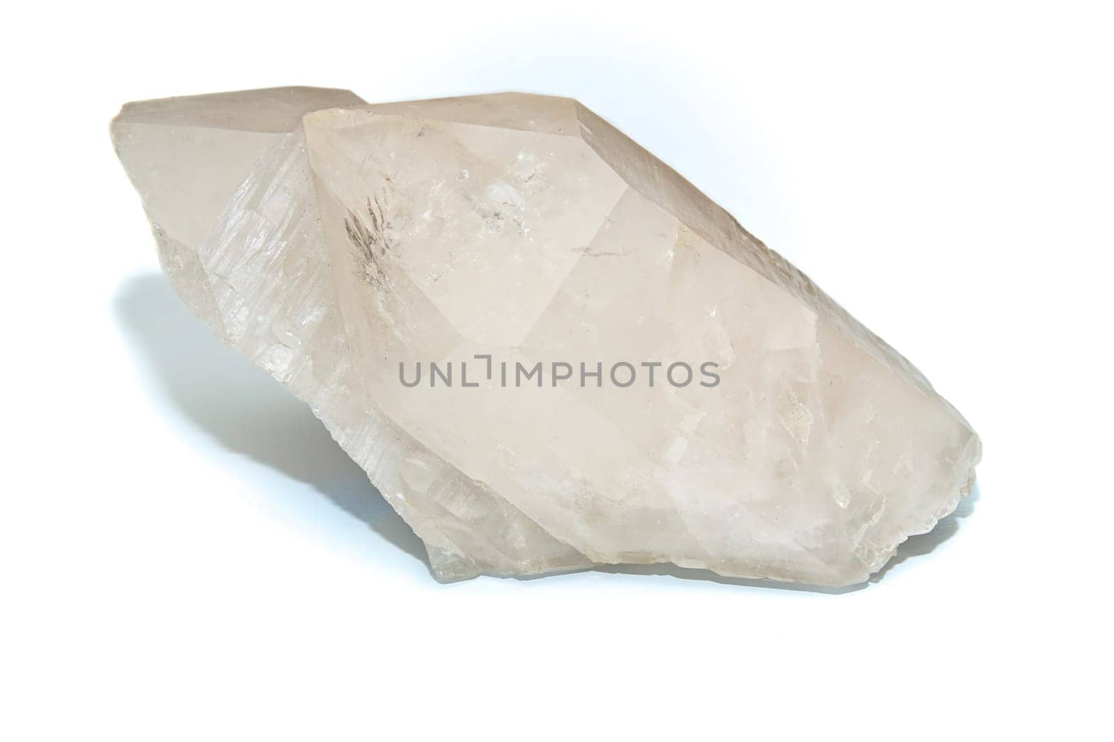 A Large double pointed clear white quartz crystal used for healing over white.