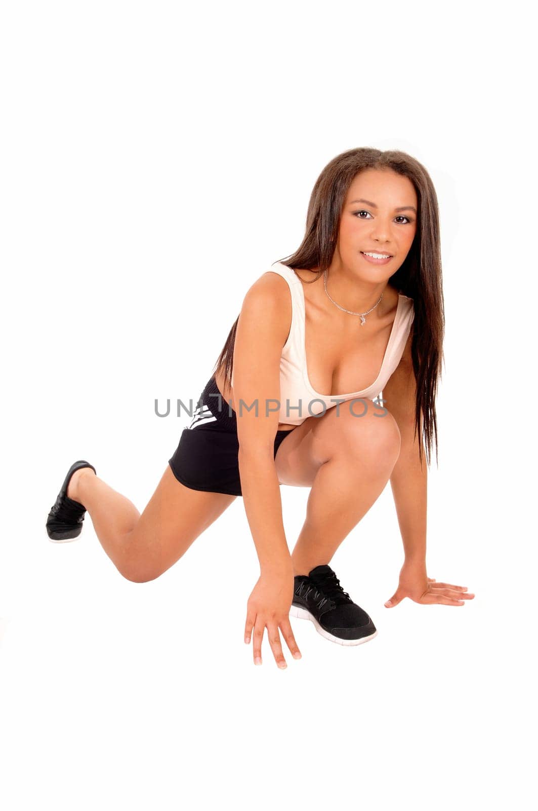 A pretty teenager girl ready for a run, isolated on white background..