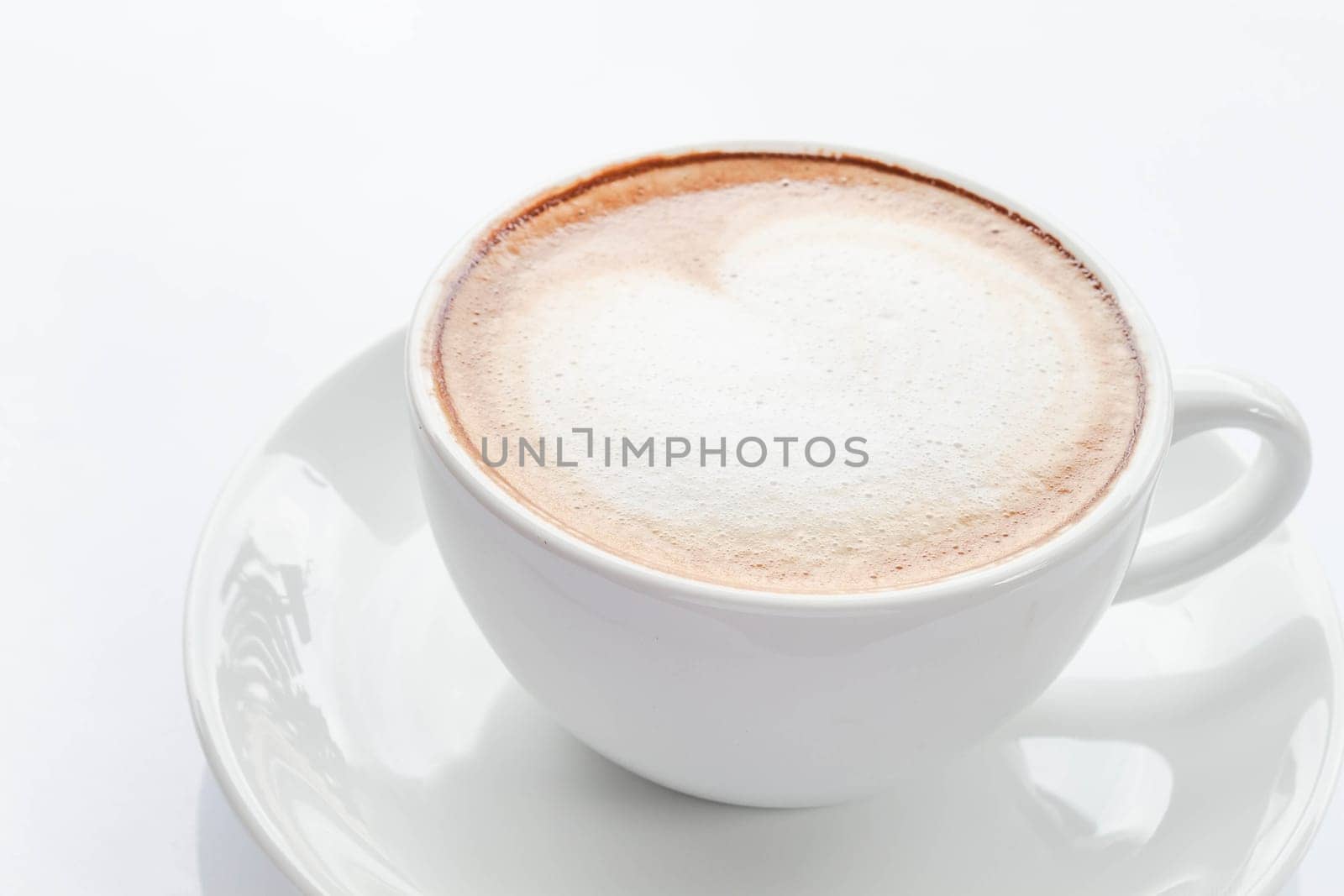 Hot cup of coffee latte isolated on white background