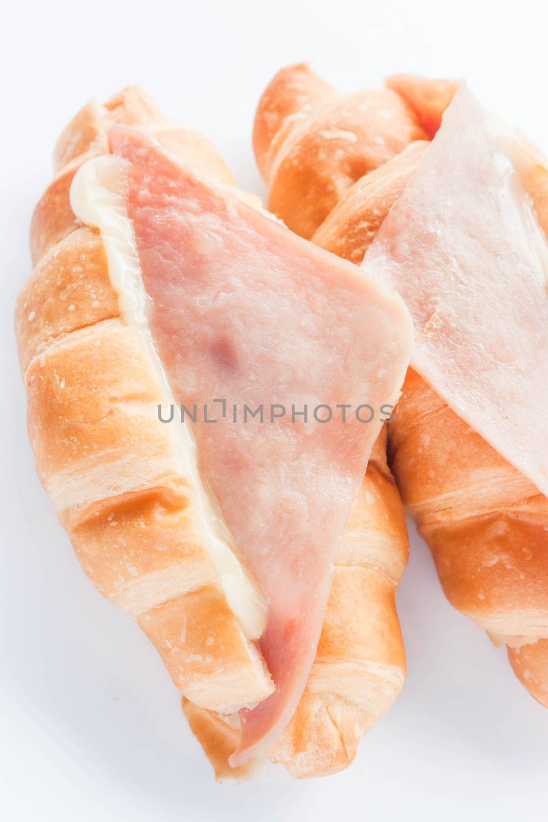 Fresh bake ham cheese croissants isolated on white background