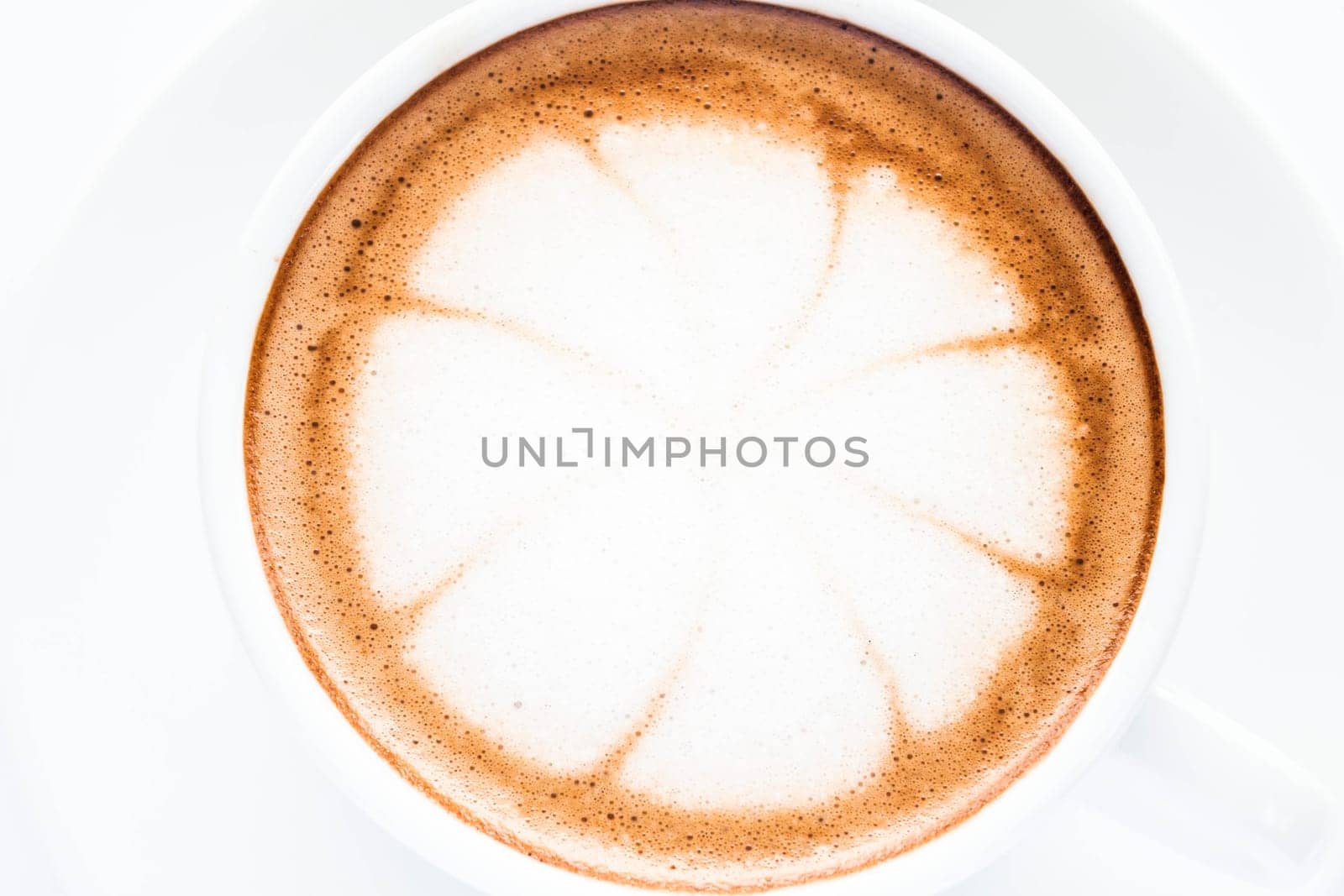 Milk microfoam top of hot mocha isolated on white background