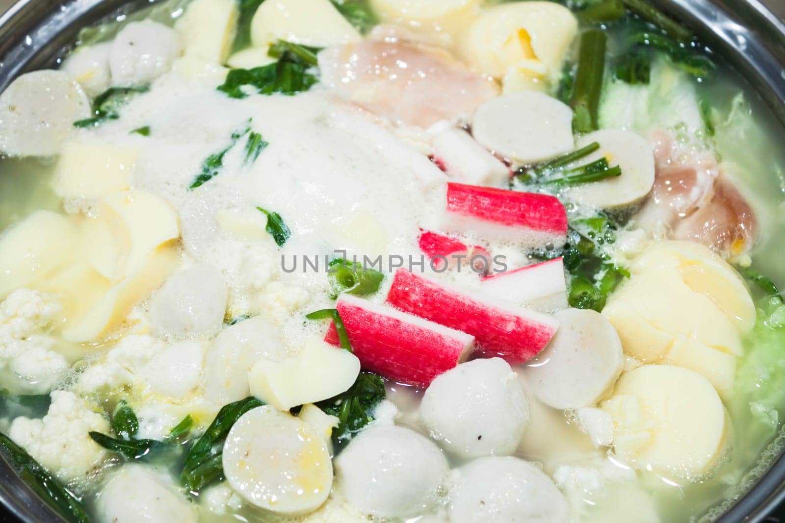 Boiling suki soup in big bowl, stock photo