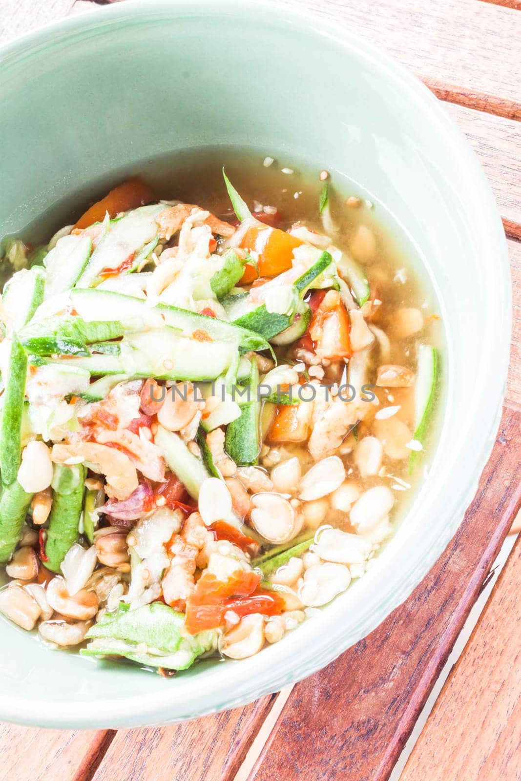 Thai style cucumber spicy salad serving, stock photo