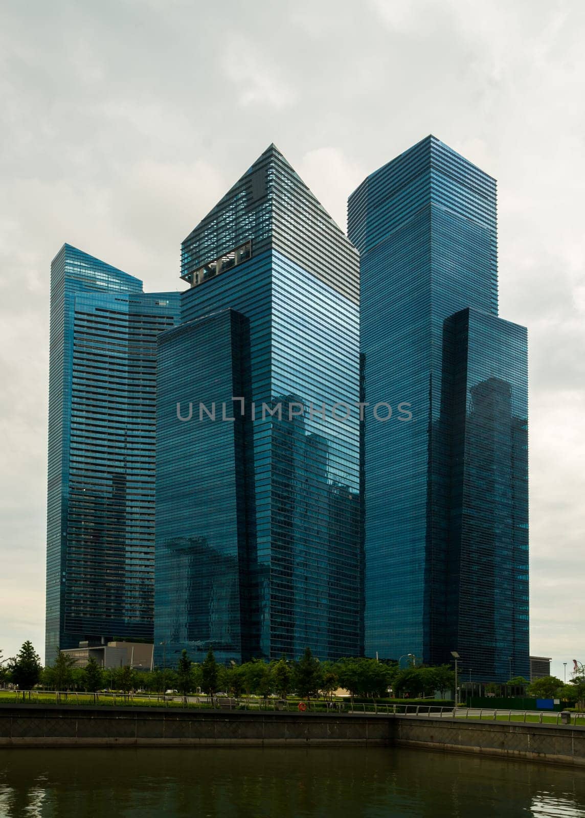 The modern and impressive skyscrapers of the Marina Bay Financial Centre in Singapore at a cloudy day