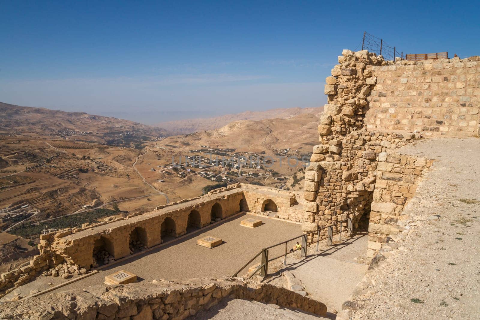 View over the impressive walls of the old crusaders castle of Karak in Jordan into the surrounding landscape