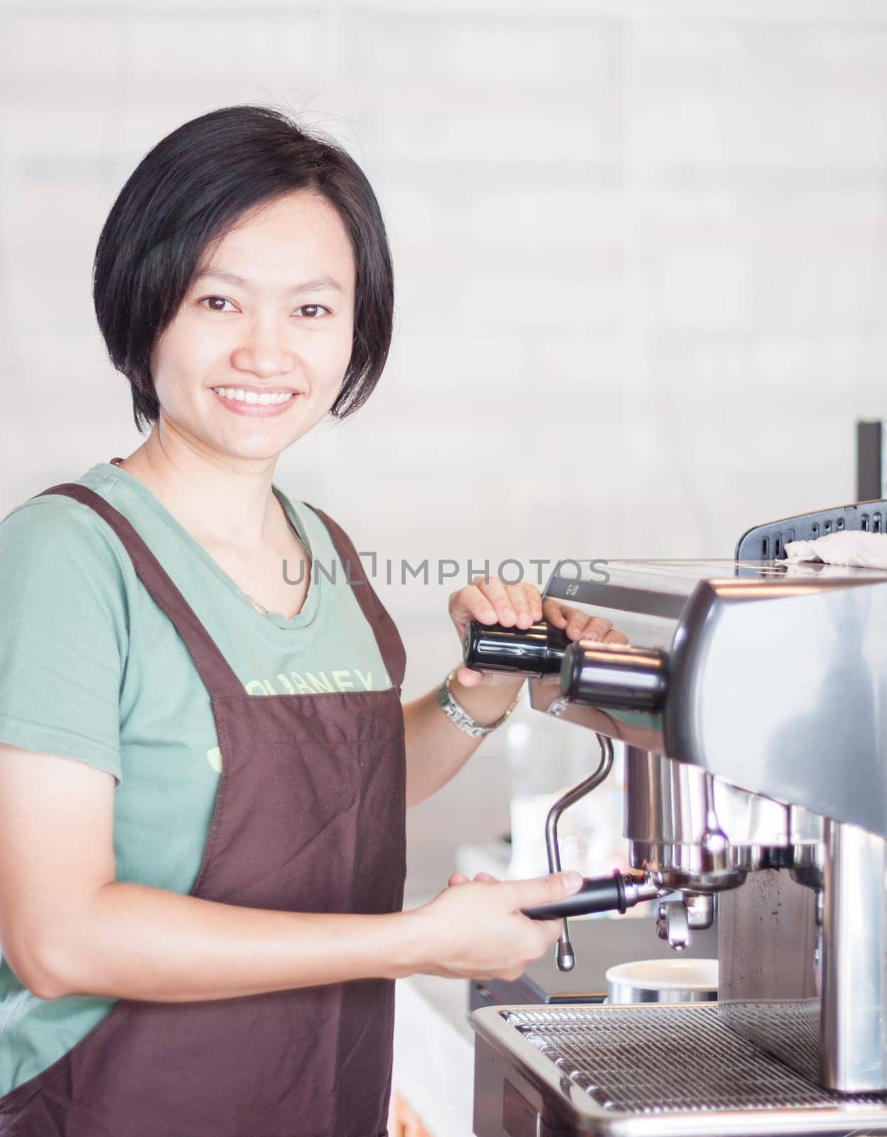 Woman barista enjoy at work, stock photo
