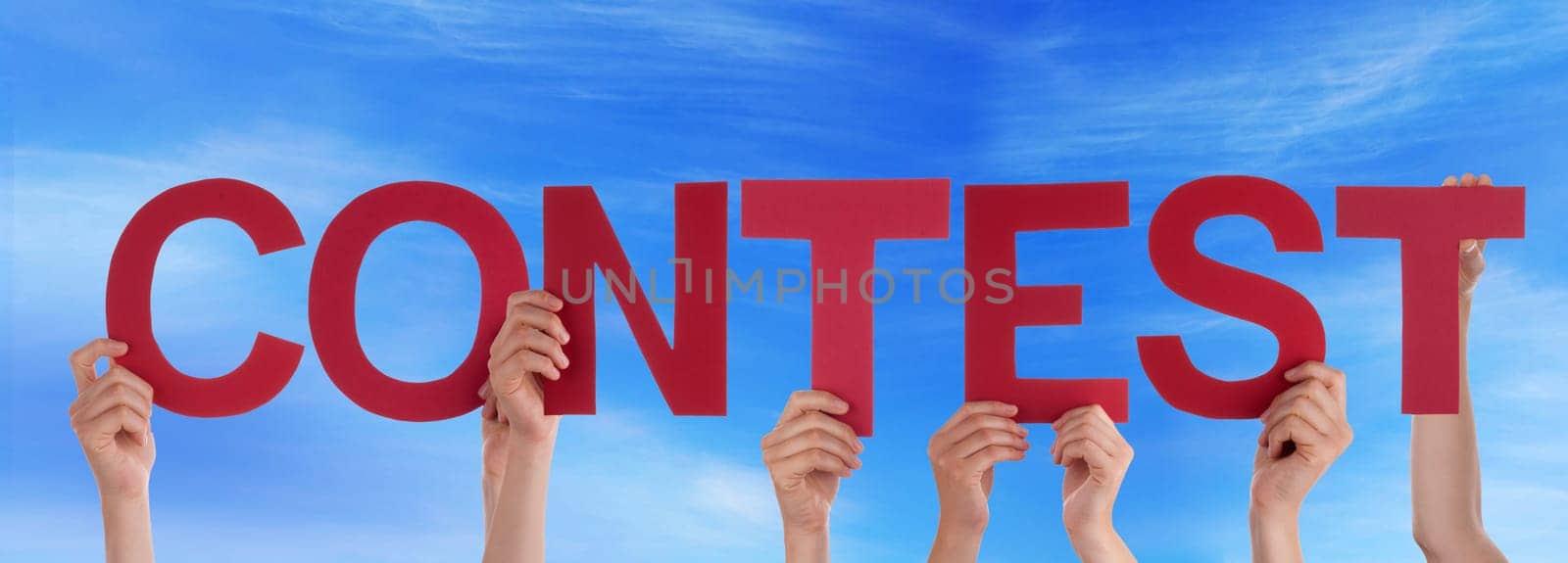 hands holding four pieces of a puzzle with copy space, gray background