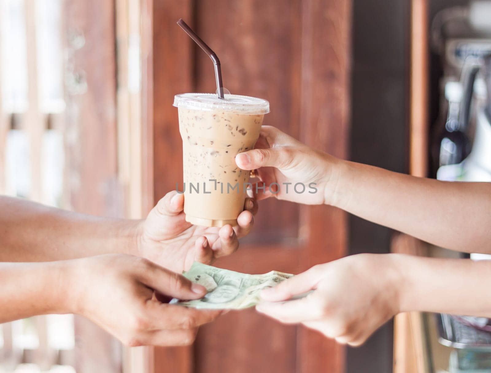 Giving money for freshly brewed coffee, stock photo