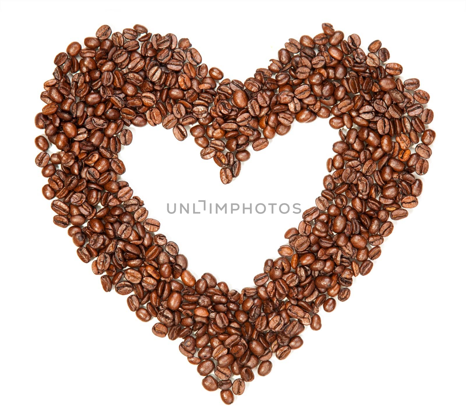 Coffee beans in a shape of hearth on white