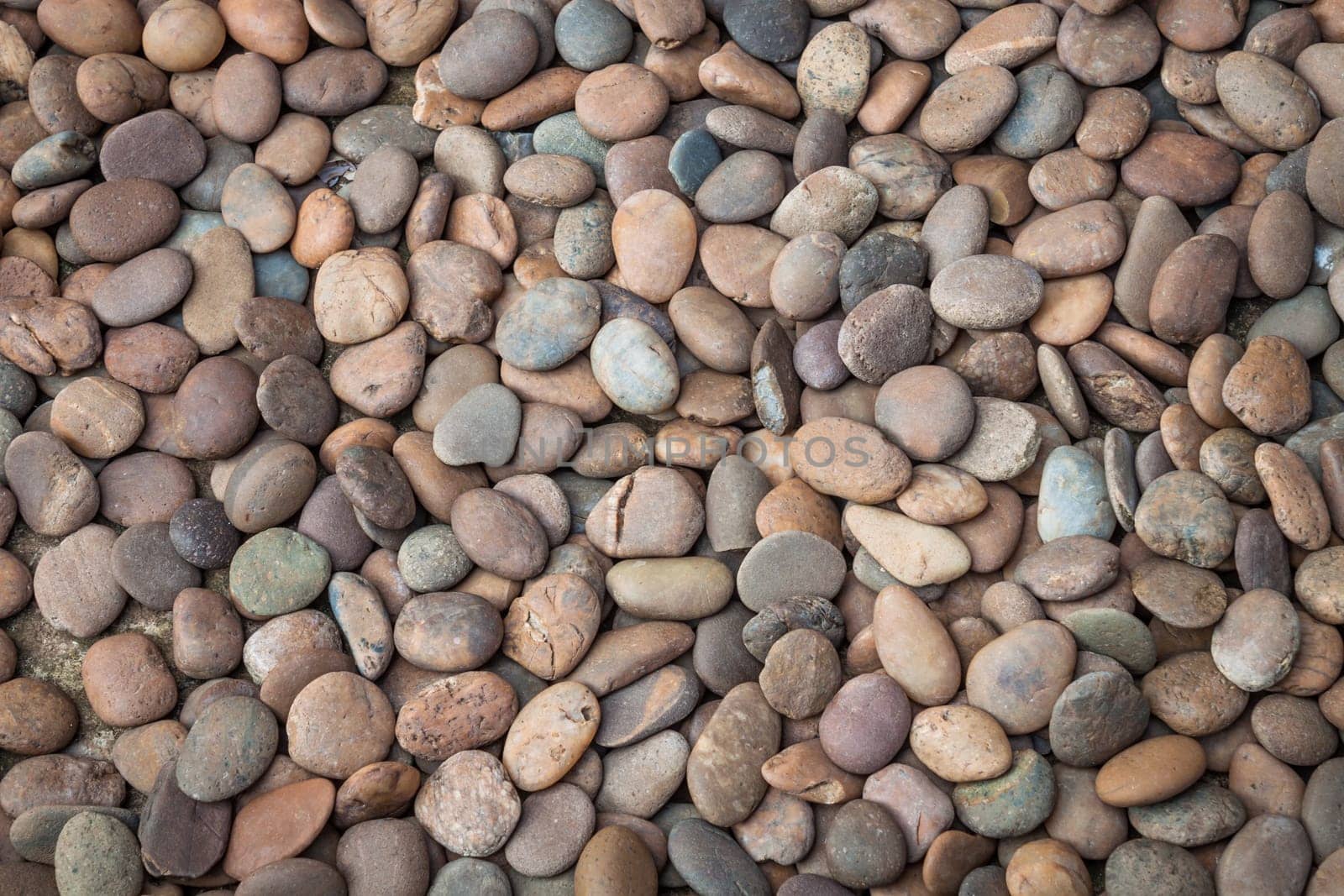 Multi colored of nature rock pebble in the garden