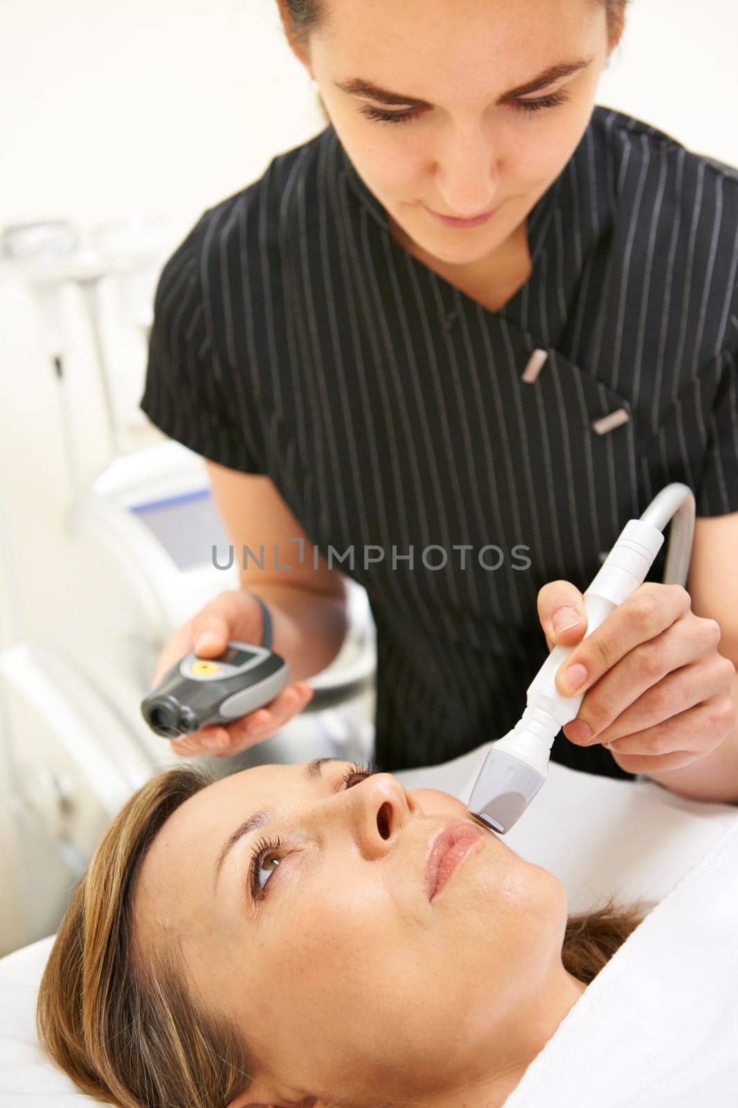 Beautician Carrying Out Ultrasound Skin Rejuvenation Treatment