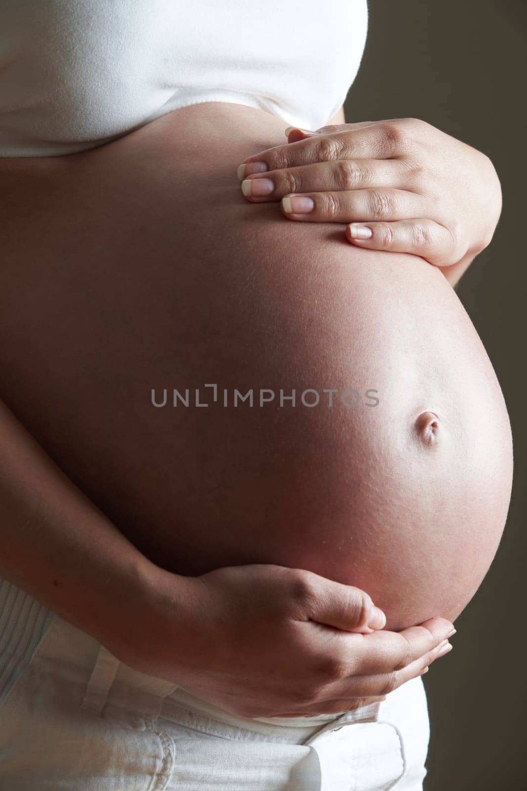 Low Key Image Of Pregnant Woman