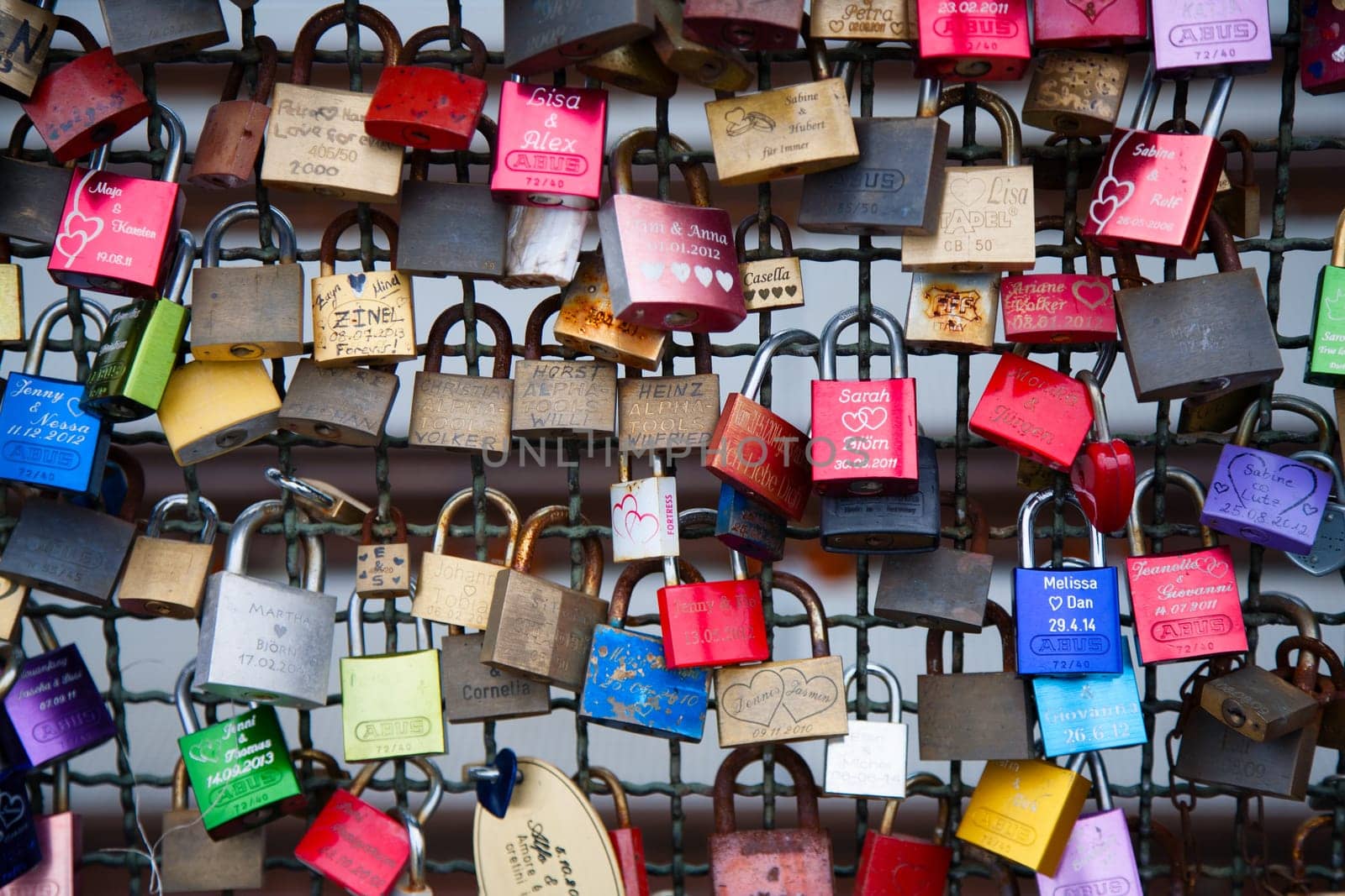 COLOGNE, GERMANY - MAY 29, 2014, Thousands of love locks which sweethearts lock to the Hohenzollern Bridge to symbolize their love on May 29 in Koln, Germany.
