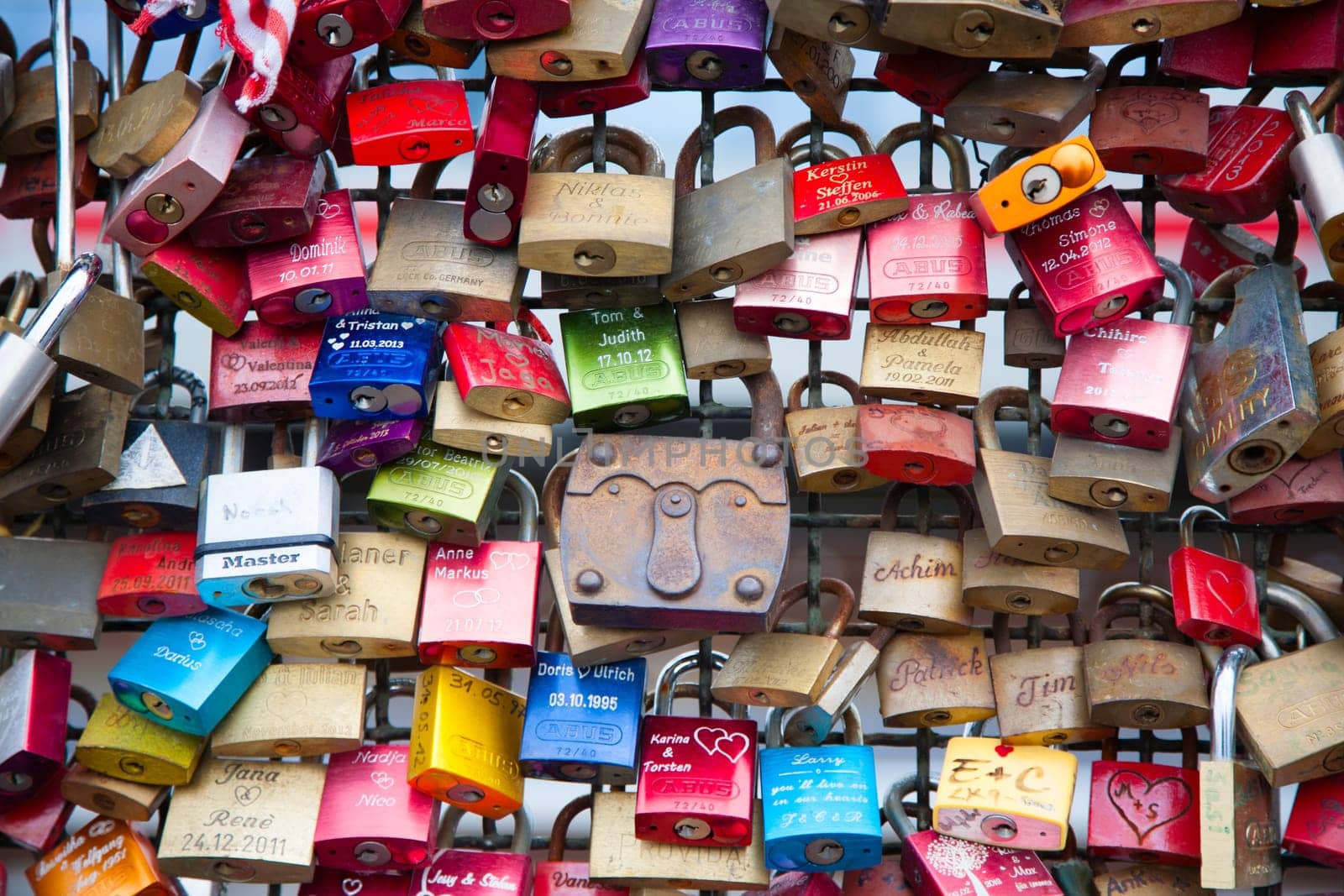 COLOGNE, GERMANY - MAY 29, 2014, Thousands of love locks which sweethearts lock to the Hohenzollern Bridge to symbolize their love on May 29 in Koln, Germany.