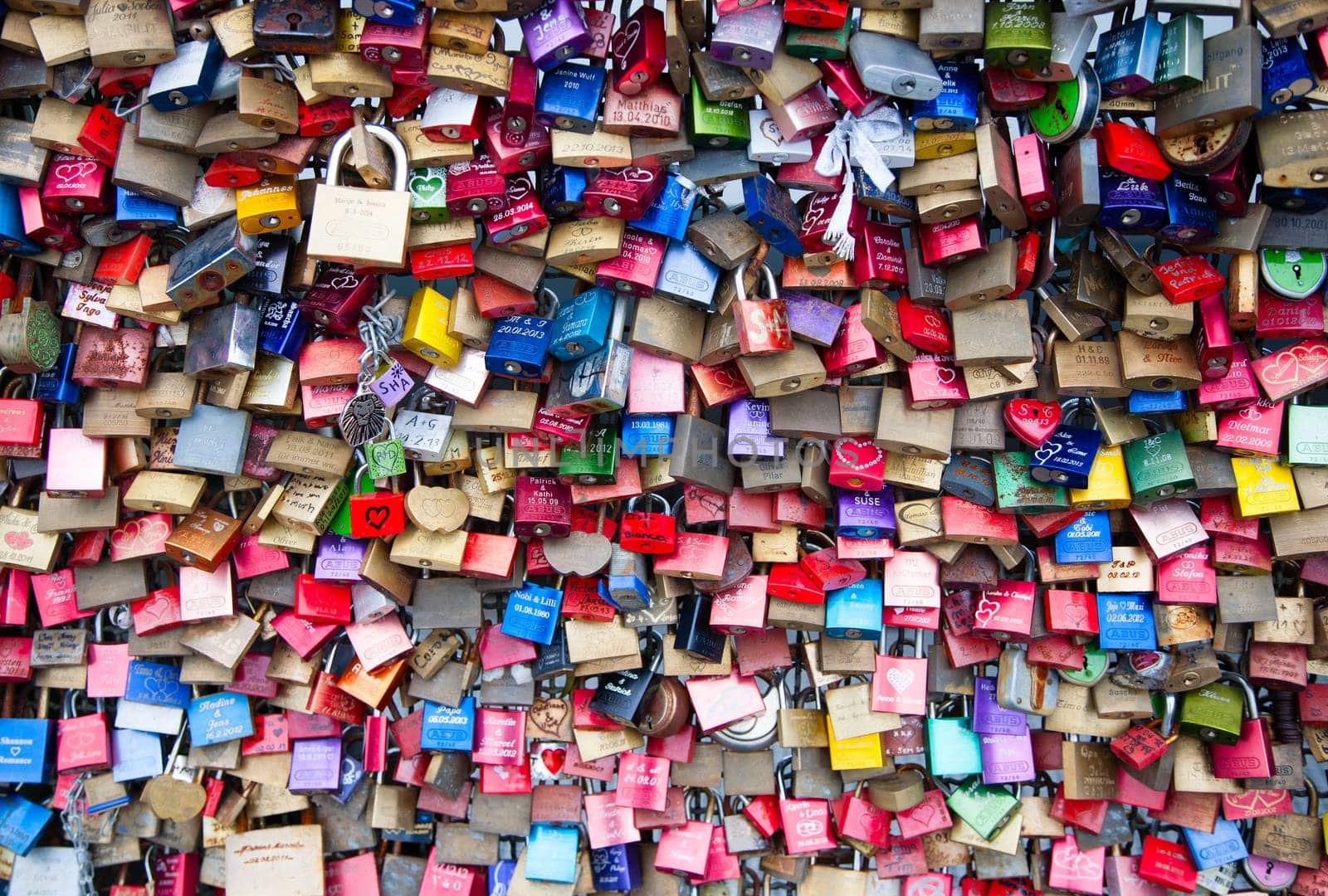 COLOGNE, GERMANY - MAY 29, 2014, Thousands of love locks which sweethearts lock to the Hohenzollern Bridge to symbolize their love on May 29 in Koln, Germany.