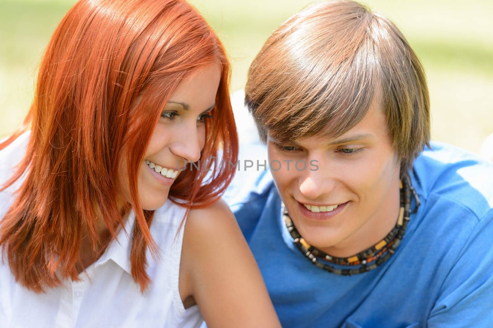 Teenage girl looking at her boyfriend enjoy summer first love