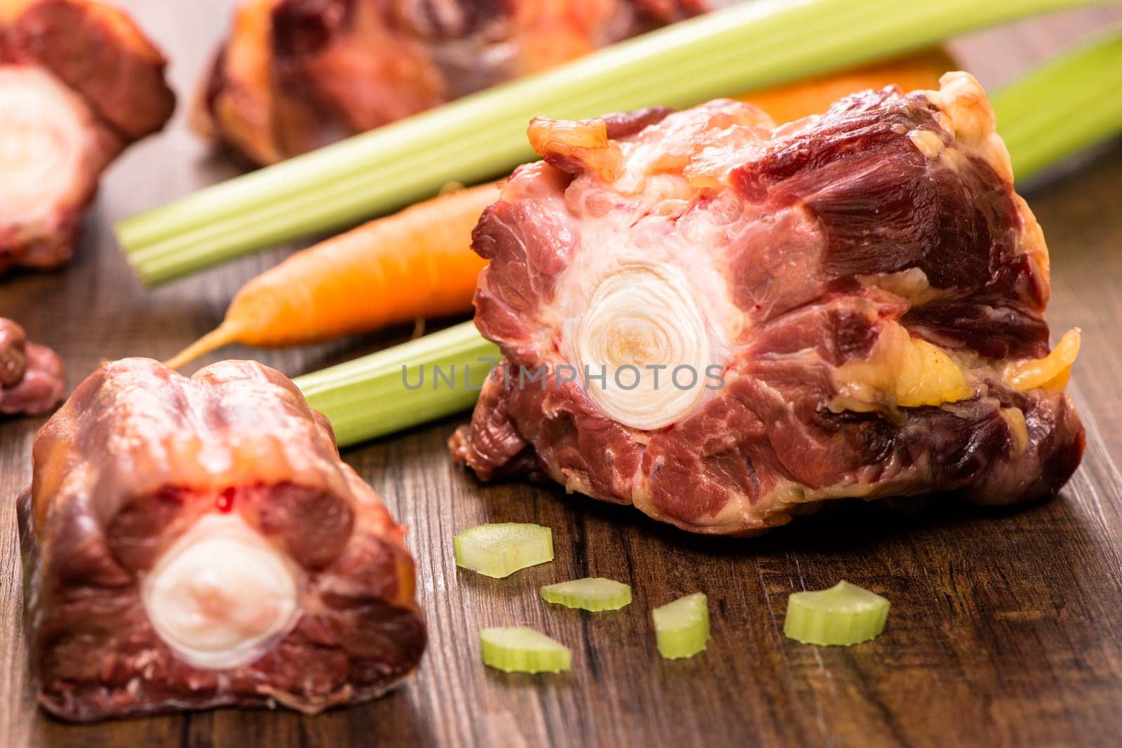 Raw oxtail and celery and carrots