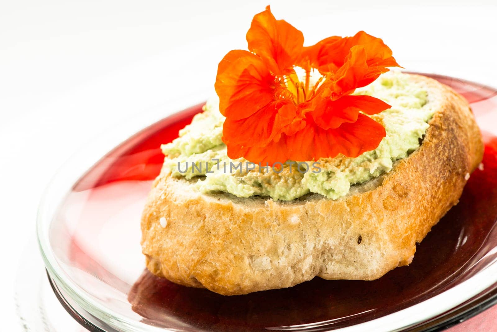 Bread rolls with wasabi cream cheese and edible flower in red