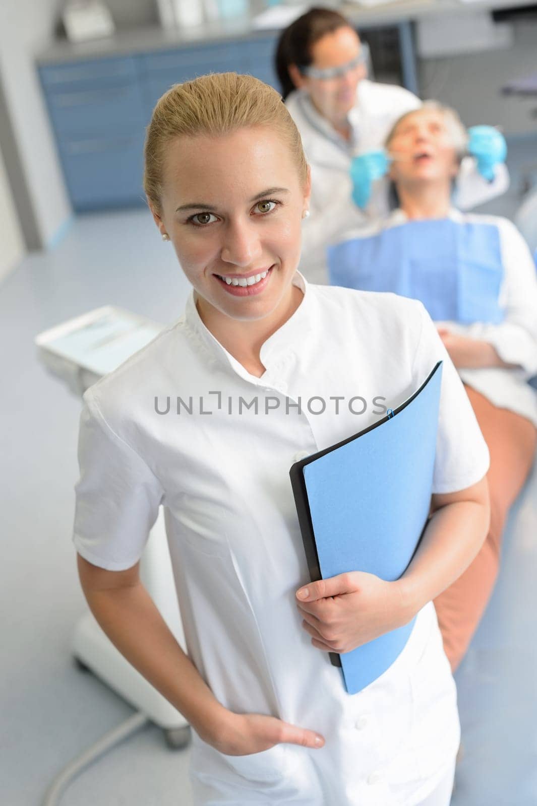 Dental assistant dentist checkup patient woman at professional clinic