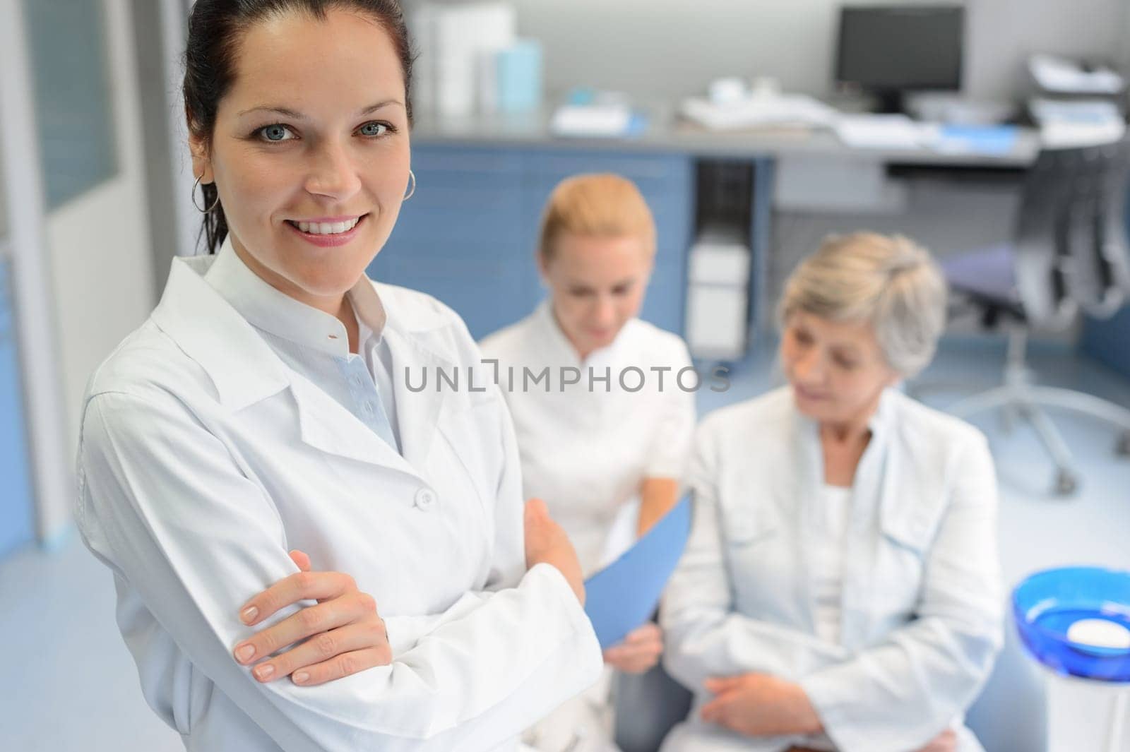 Professional dentist woman looking camera senior patient dental  assistant surgery