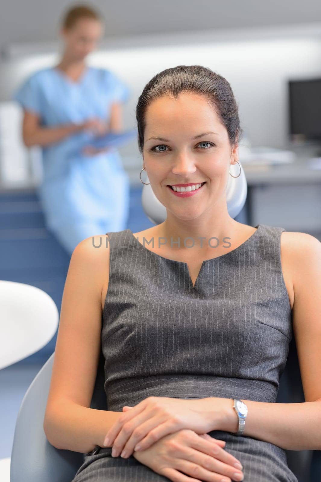 Businesswoman patient sitting chair at dental surgery teeth checkup