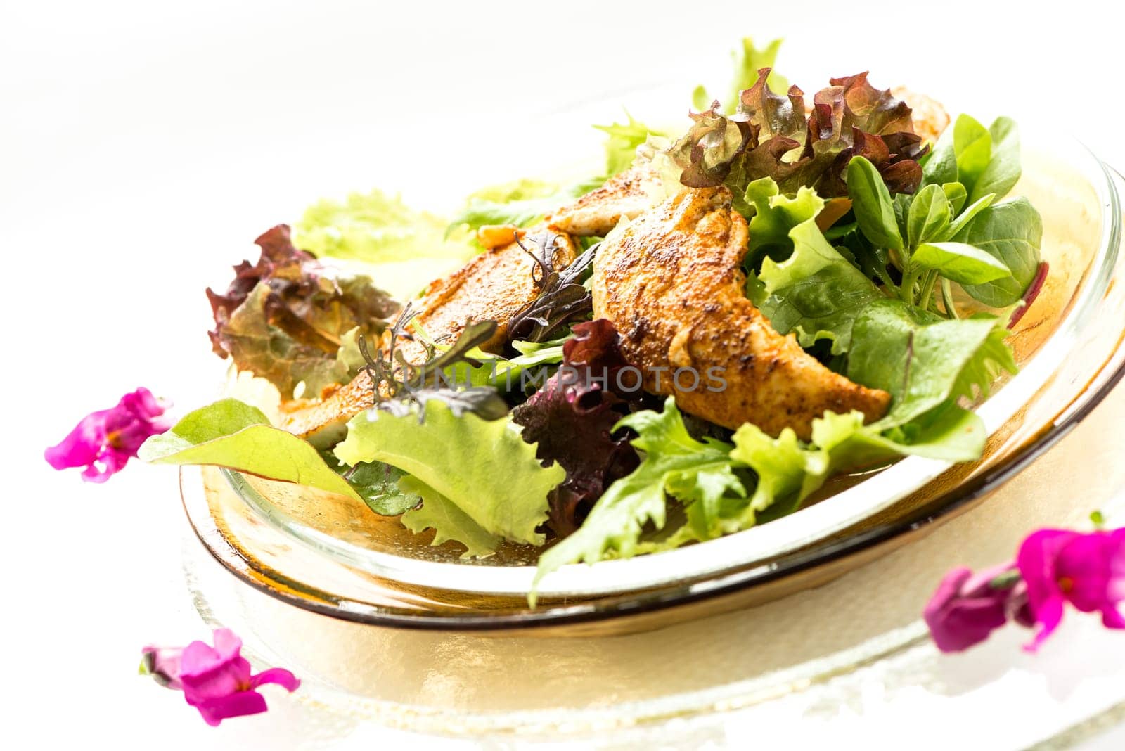 Roasted chicken with lettuce on a plate