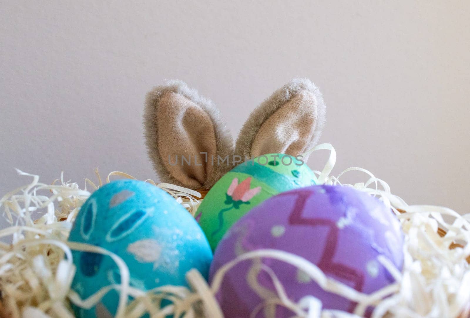 Easter eggs , flowers and funny bunny to celebrate Easter holidays and splring. Space for copy.Wallpaper for Easter announcements and cards.Horizontal real picture