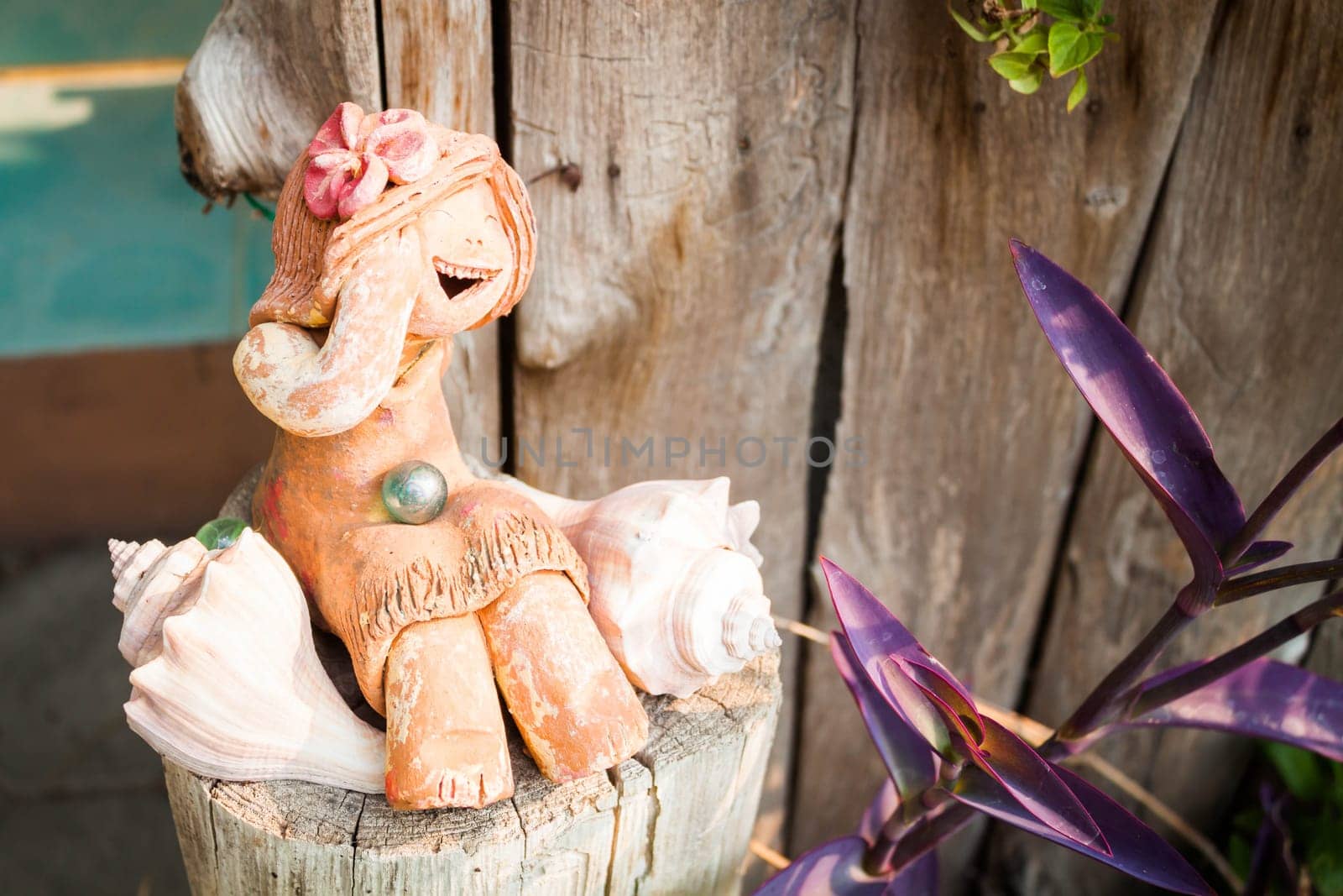 Happy clay doll used in ornamental garden