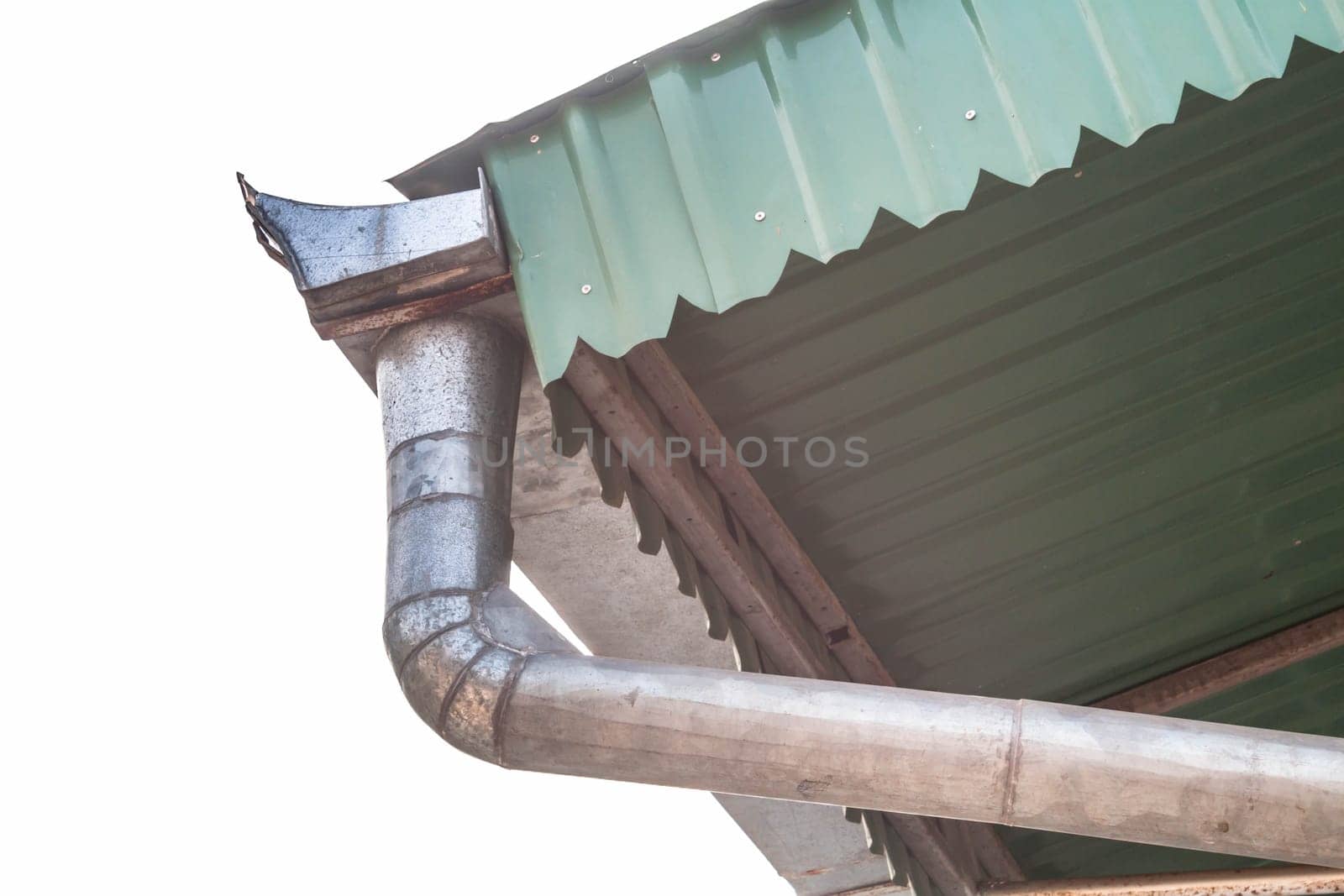 Outdoors aluminum roof gutter in front of the sky
