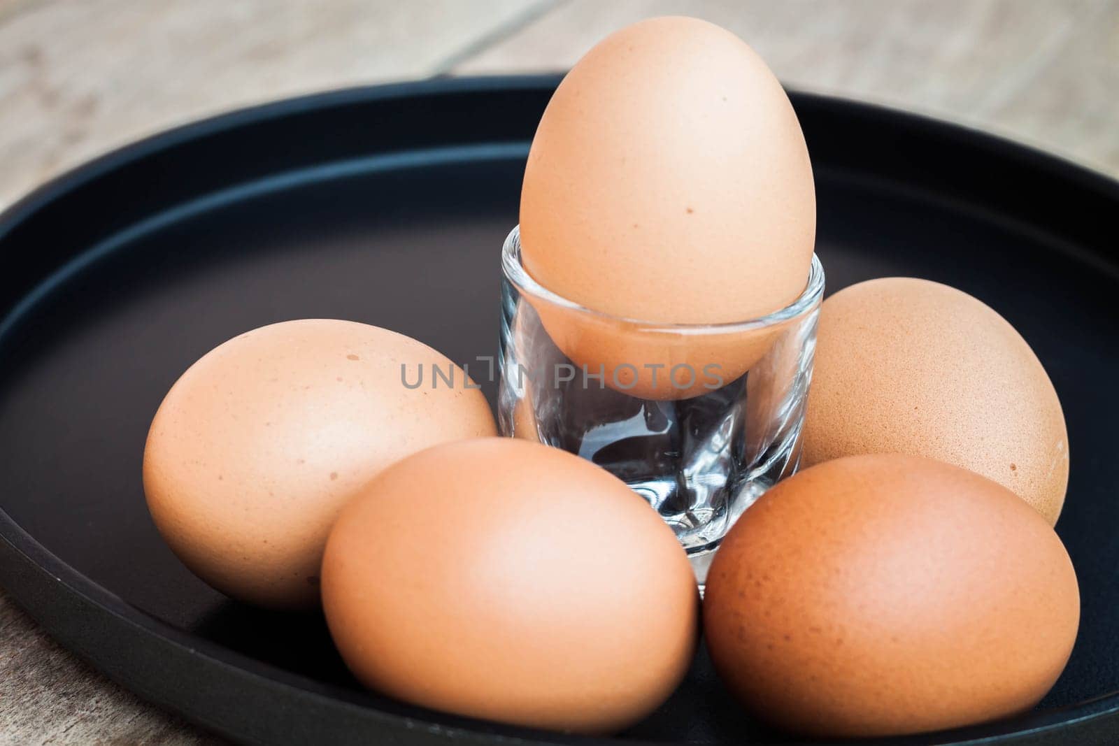 Many eggs in a black tray