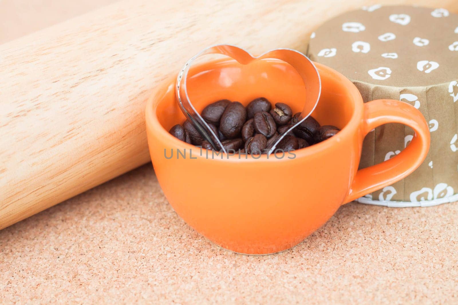 Heart cookies cutter in cup of coffee bean